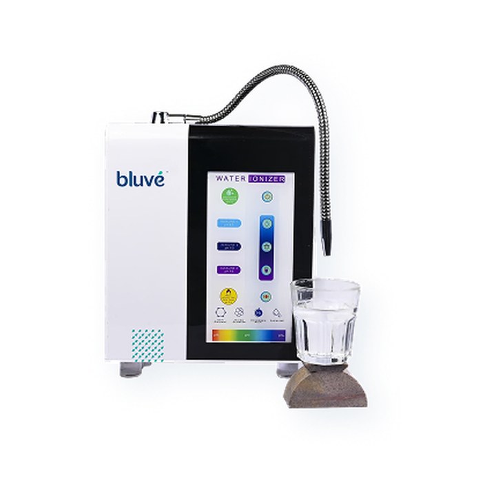 Bluvé Alkaline Water Ionizer with a glass of water